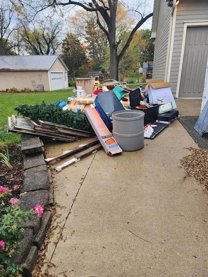 Dumpster being loaded with debris for 3 Yard Dumpster Rental in Waldwick
